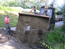 WPC staff install a culvert, which will help
channel water.