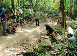 WPC staff, volunteers and paid contractors maneuvered large rocks as
part of a trail restoration project.