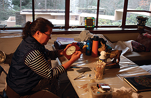 Victoria Jefferies, a wood conservator, works on 
some of the objects in the Fallingwater collections.  