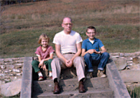 Tissue family descendants Betsy, Bill and Will Scarlett, on the
steps of the former family farmhouse, circa 1961.